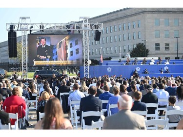 People gather outside of the Pentagon as they pay tribute to commemorate the 20th anniversary of the 9/11 attacks, on Sept. 11, 2021, in Washington, D.C.