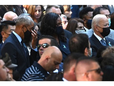 U.S. President Joe Biden, right, former U.S. president Barack Obama, left, and former first lady Michelle Obama, centre, attend a ceremony commemorating the 20th anniversary of the 9/11 attacks on the World Trade Center, in New York, on Sept. 11, 2021.