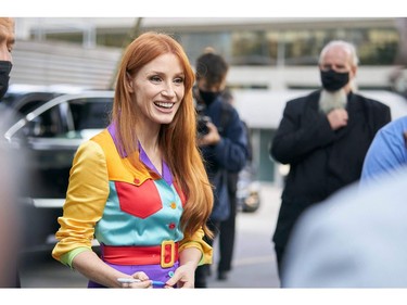 Actress Jessica Chastain smiles at a fan following a press conference at Roy Thompson Hall for the Toronto International Film Festival in Toronto, Sept. 11, 2021.
