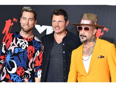 (From L) US singers Lance Bass, Nick Lachey and AJ McLean arrive for the 2021 MTV Video Music Awards at Barclays Center in Brooklyn, New York, September 12, 2021. (Photo by ANGELA  WEISS / AFP)