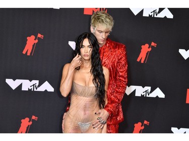 US actress Megan Fox (L) and Us singer Machine Gun Kelly arrive for the 2021 MTV Video Music Awards at Barclays Center in Brooklyn, New York, September 12, 2021. (Photo by ANGELA  WEISS / AFP)