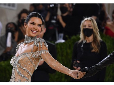 US model Kendall Jenner arrives for the 2021 Met Gala at the Metropolitan Museum of Art on September 13, 2021 in New York. - This year's Met Gala has a distinctively youthful imprint, hosted by singer Billie Eilish, actor Timothee Chalamet, poet Amanda Gorman and tennis star Naomi Osaka, none of them older than 25. The 2021 theme is "In America: A Lexicon of Fashion." (Photo by Angela WEISS / AFP)