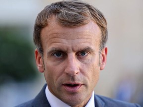 French President Emmanuel Macron looks on after a working lunch with Lebanese Prime Minister at the Elysee Palace, in Paris, on September 24, 2021.