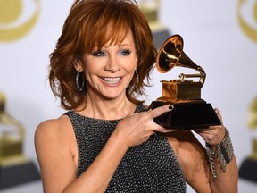 Recording artist Reba McEntire, winner of the Best Roots Gospel Album award for 'Sing It Now: Songs of Faith & Hope,' poses in the press room during the 60th Annual Grammy Awards on January 28, 2018, in New York.