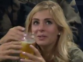One woman at a match at the U.S. Open on Friday was caught on video downing glasses of beer -- and the video went viral.
