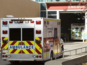 Ambulances are seen outside of the Royal Alexandria Hospital in Edmonton, Alta., on Thursday, Oct. 16, 2014.