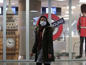 A woman walks past the closed entrance of the Eurostar terminal at Brussels South railway station after Britain's European neighbors began closing their doors to travelers from the United Kingdom amid alarm about a rapidly spreading strain of coronavirus, in Brussels, Belgium December 21, 2020.
