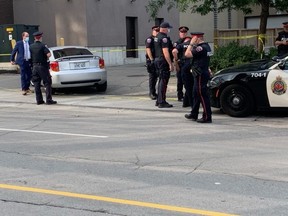 Hamilton Police investigate at the scene of a fatal shooting on Tuesday, Sept. 14, 2021.