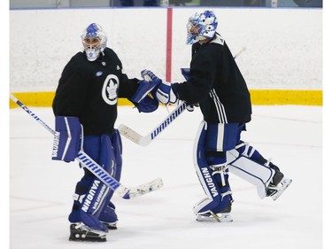 Toronto Maple Leafs goalie tandem of Petr Mrazek (left) and Jack Campbell switch off the ice during a scrimmage at their practice facility in Etobicoke on Wednesday September 15, 2021. Jack Boland/Toronto Sun/Postmedia Network