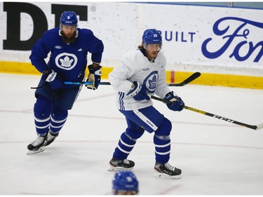 Toronto Maple Leafs defenceman Jake Muzzin (8)  with forward Rich Clune (39) on the  ice at their practice facility in Etobicoke on Wednesday September 15, 2021. Jack Boland/Toronto Sun/Postmedia Network