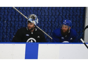 Toronto Maple Leafs goalie Jack Campbell on the bench with defenceman Justin Holl (8 - right)   at their practice facility in Etobicoke on Wednesday September 15, 2021. Jack Boland/Toronto Sun/Postmedia Network