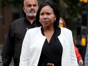 Aissatou Diallo walks to the court house with her lawyers in Ottawa Wednesday morning.