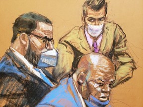 R. Kelly sits with his lawyers Calvin Scholar and Thomas Farinella as the jury deliberate in Kelly’s sex abuse trial at Brooklyn’s Federal District Court in a courtroom sketch in New York, U.S., September 27, 2021.