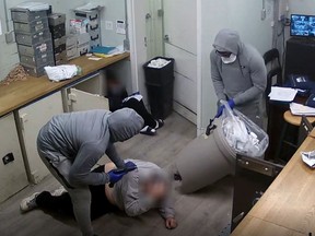 Two suspects force employees to empty safes full of cash on April 1, 2021