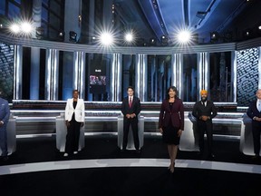 (From L) Bloc Quebecois Leader Yves-Francois Blanchet, Green Party Leader Annamie Paul, Canadian Prime Minister and Liberal Leader Justin Trudeau, moderator Shachi Kurl, president of the Angus Reid Institute, NDP Leader Jagmeet Singh, and Conservative Leader Erin O'Toole pose for an official photo before the federal election English-language Leaders debate in Gatineau, Quebec, Canada on Sept. 9, 2021.
