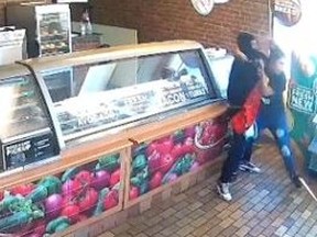 Footage from Subway in Illinois shows employee getting into a fight with an armed robber.