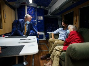 Former Canadian Prime Minister Jean Chretien, left, speaks with Liberal Leader Justin Trudeau and former Mississauga Mayor Hazel McCallion in Brampton, Ont. on Tuesday, Sept. 14 2021