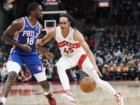 Toronto Raptors guard Dalano Banton drives to the basket against Philadelphia 76ers guard Shake Milton during their pre-season game.