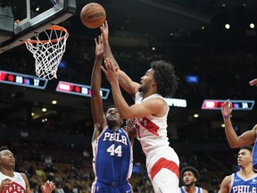 Toronto Raptors forward Justin Champagnie shoots against Philadelphia 76ers forward Paul Reed.