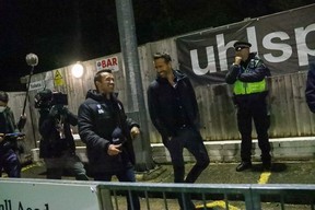 Wrexham team owners Ryan Reynolds and Rob McElhenney are surrounded by security at the stadium. Gemma Thomas Photography/Wrexham AFC/TWITTER