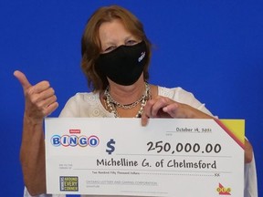 Michelline Giguere, of Chelmsford, with her $250,000 winnings.