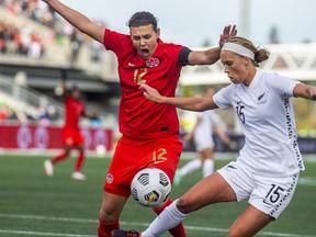 New Zealand’s  Daisy Cleverley receives a penalty while battling against Canada’s Christine Sinclair in Ottawa yesterday.