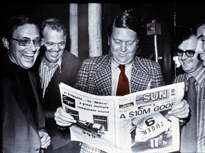 Former publisher Doug Creighton holds the first copy of The Toronto Sun on Nov. 1, 1971 with Ray Biggart, Peter Worthington and general manager Don Hunt.