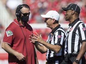 Nick Rolovich, head coach of the Washington State Cougars, talks with officials during their game against the Utah Utes September 25, 2021 at Rice Eccles Stadium in Salt Lake City, Utah.