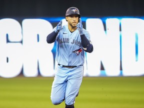 George Springer #4 of the Toronto Blue Jays celebrates his grand slam home run against the Baltimore Orioles in the third inning during their MLB game at the Rogers Centre on October 3, 2021 in Toronto.