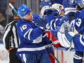 A relieved Mitch Marner is congratulated at the bench on Saturday night after finally scoring his first goal of the season in the 5-4 win over the Red Wings.