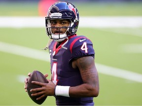 Deshaun Watson of the Houston Texans participates in warmups prior to a game against the Tennessee Titans at NRG Stadium on January 03, 2021 in Houston, Texas.