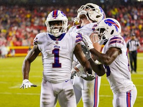 Buffalo Bills wide receiver Emmanuel Sanders (left) celebrates with tight end Dawson Knox (88) and wide receiver Isaiah McKenzie (19) after scoring a touchdown against the Kansas City Chiefs.