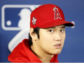 Shohei Ohtani of the Los Angeles Angels looks on before the game against the Seattle Mariners at T-Mobile Park on October 03, 2021 in Seattle, Washington.