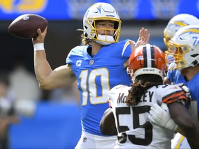 Justin Herbert of the Chargers throws a pass.