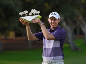 Matthew Fitzpatrick of England poses with the trophy after winning The Estrella Damm N.A. Andalucia Masters at Real Club Valderrama on October 17, 2021 in Cadiz, Spain.