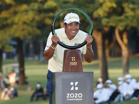 Hideki Matsuyama of Japan poses with the trophy after winning the tournament following the final round of the ZOZO Championship at Accordia Golf Narashino Country Club on October 24, 2021 in Inzai, Chiba, Japan.