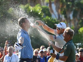 Jeff Winther of Denmark celebrates winning on the 18th hole with JB Hansen and Soren Kjeldsen of Demark during the final round of Mallorca Golf Open at Golf Santa Ponsa on October 24, 2021 in Mallorca, Spain.