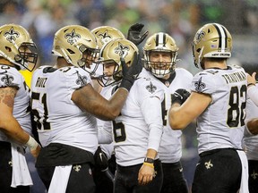 Brian Johnson #6 of the New Orleans Saints is congratulated by teammates following a field goal late in the fourth quarter against the Seattle Seahawks at Lumen Field on October 25, 2021 in Seattle, Washington.