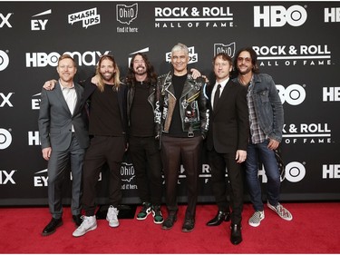 Left to right: Nate Mendel, Taylor Hawkins, Dave Grohl, Pat Smear, Chris Shiflett and Rami Jaffee of Foo Fighters attend the 36th Annual Rock & Roll Hall Of Fame Induction Ceremony at Rocket Mortgage Fieldhouse on Oct. 30, 2021 in Cleveland, Ohio.
