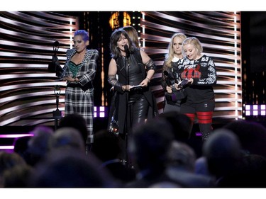 Left to right: 2021 Inductees Jane Wiedlin, Kathy Valentine, Belinda Carlisle, Charlotte Caffey and Gina Schock of The Go-Go's speak onstage during the 36th Annual Rock & Roll Hall Of Fame Induction Ceremony at Rocket Mortgage Fieldhouse on Oct. 30, 2021 in Cleveland, Ohio.