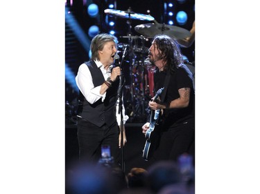 Paul McCartney and Dave Grohl perform onstage during the 36th Annual Rock & Roll Hall Of Fame Induction Ceremony at Rocket Mortgage Fieldhouse on Oct. 30, 2021 in Cleveland, Ohio.