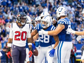Indianapolis Colts running back Jonathan Taylor (28) celebrates his first touchdown of the game with teammates in the second half against the Houston Texans.