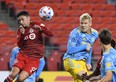 Philadelphia Union defender Jakob Glesnes (5) heads the ball past Toronto FC midfielder Mark Delgado.