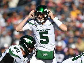 New York Jets quarterback Mike White calls a play against the New England Patriots.