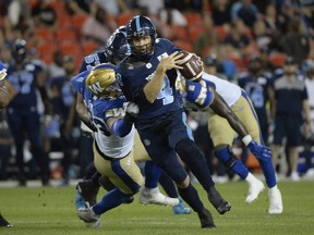 Argonauts quarterback McLeod Bethel-Thompson (4) runs for the first down against the Winnipeg Blue Bombers.