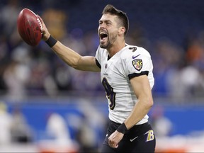 Ravens kicker Justin Tucker (9) celebrates while leaving the field after defeating the Detroit Lions at Ford Field.