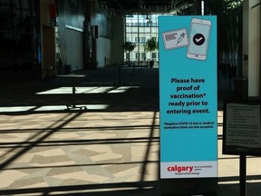 A notice in the Telus Convention Centre in Calgary lets guests know they need to provide proof of COVID-19 vaccination on Wednesday, September 29, 2021.