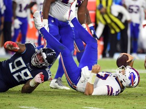 Tennessee Titans defensive end Jeffery Simmons (98) sacks Buffalo Bills quarterback Josh Allen (17) during the second half at Nissan Stadium Oct. 18, 2021 in Nashville.