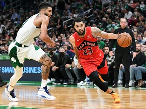 Raptors guard Fred VanVleet (23) drives to the basket against Boston Celtics forward Jayson Tatum.