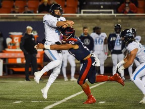 Alouettes defensive linesman Jamal Davis  drills Toronto Argonauts quarterback McLeod Bethel-Thompson at Molson Stadium last Friday.